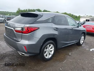 2016 Lexus RX 350 z VIN 2T2BZMCA5GC052214, wystawiony jako IAAI lot #42669843 z przebiegiem 93 891 mil mil oraz . Historia ofert i sprzedaży dostępna na DreamBid. Obrazek 4.