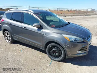 2014 Ford Escape Titanium with VIN 1FMCU9J9XEUA90305, listed as a IAAI auction lot 41724436 with 165,518 mi miles. Bid and sale history available at carsss.com. Image 1.