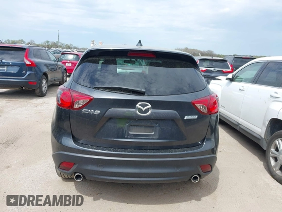 2014 Mazda CX-5 Grand Touring with VIN JM3KE2DY0E0354220, listed as a IAAI auction lot 41885502 with 168,901 mi miles. Bid and sale history available at carsss.com. Image 16.