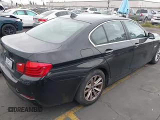 2015 BMW 5 Series 528i with VIN WBA5A5C56FD514814, listed as a IAAI auction lot 42052381 with 76,306 mi miles. Bid and sale history available at carsss.com. Image 4.