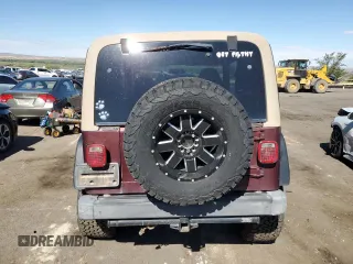 2002 Jeep Wrangler Sahara with VIN 1J4FA59S12P704608, listed as a Copart auction lot 69146504 with 125,920 mi miles and Salvage Title. Bid and sale history available at carsss.com. Image 6.