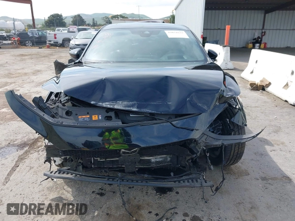 2021 Mazda 3 Premium Plus z VIN JM1BPBNY2M1403797, wystawiony jako IAAI lot #42031637 z przebiegiem Nie podano mil oraz . Historia ofert i sprzedaży dostępna na DreamBid. Obrazek 12.