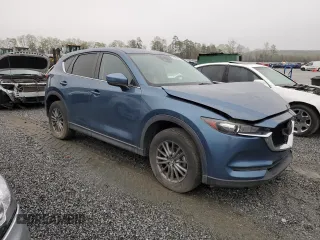 2017 Mazda CX-5 Touring with VIN JM3KFBCLXH0124451, listed as a Copart auction lot 51060275 with 126,807 mi miles and Salvage Title. Bid and sale history available at carsss.com. Image 4.