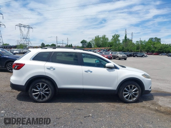 2014 Mazda CX-9 Grand Touring z VIN JM3TB3DV0E0436649, wystawiony jako IAAI lot #42319638 z przebiegiem 128 421 mil mil oraz . Historia ofert i sprzedaży dostępna na DreamBid. Obrazek 13.