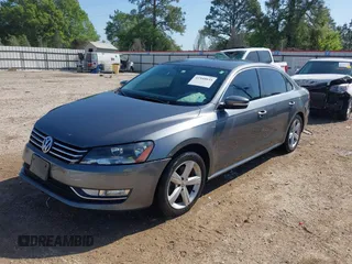 2015 Volkswagen Passat 1.8T Wolfsburg Ed with VIN 1VWAT7A3XFC115934, listed as a IAAI auction lot 41948035 with 243,143 mi miles. Bid and sale history available at carsss.com. Image 18.