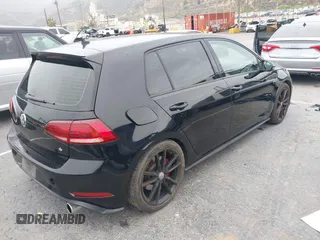 2019 Volkswagen Golf GTI S with VIN 3VW5T7AU3KM005648, listed as a IAAI auction lot 42096528 with 57,352 mi miles. Bid and sale history available at carsss.com. Image 4.