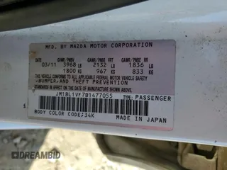 2011 Mazda 3 i Touring with VIN JM1BL1VF7B1477055, listed as a Copart auction lot 50025175 with 106,107 mi miles and Salvage Title. Bid and sale history available at DreamBid. Image 12.