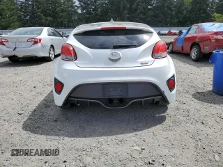 2013 Hyundai Veloster Turbo z VIN KMHTC6AE2DU163017, wystawiony jako Copart lot #56804365 z przebiegiem 105 325 mil mil oraz Czysty tytuł • Clean title. Historia ofert i sprzedaży dostępna na DreamBid. Obrazek 6.