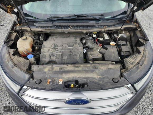 2015 Ford Edge SE z VIN 2FMTK3G85FBB63721, wystawiony jako Copart lot #61476615 z przebiegiem 145 026 mil mil oraz Szkoda całkowita • Salvage title. Historia ofert i sprzedaży dostępna na DreamBid. Obrazek 11.