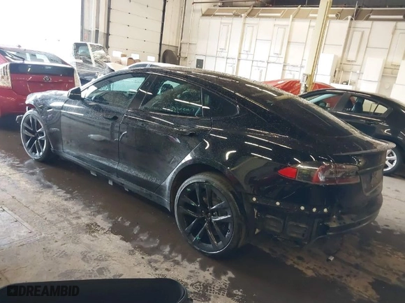 2021 Tesla Model S Plaid with VIN 5YJSA1E63MF433666, listed as a IAAI auction lot 41384955 with 31,760 mi miles. Bid and sale history available at carsss.com. Image 3.