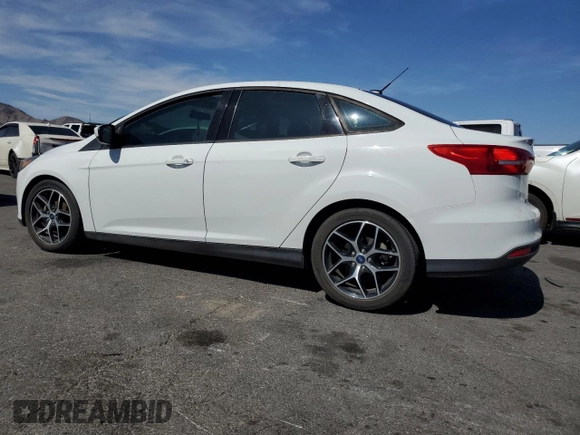 2018 Ford Focus SE with VIN 1FADP3FE4JL322857, listed as a Copart auction lot 58090025 with 58,148 mi miles and Clean title. Bid and sale history available at DreamBid. Image 2.