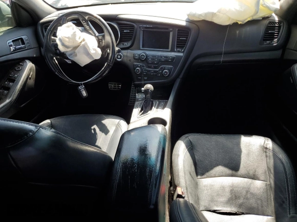 2013 Kia Optima SX with VIN 5XXGR4A60DG213906, listed as a Copart auction lot 60121165 with 121,559 mi miles and Salvage title. Bid and sale history available at DreamBid. Image 8.
