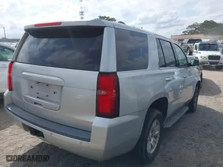 2017 Chevrolet Tahoe Commercial with VIN 1GNLCDECXHR238788, listed as a IAAI auction lot 41718161 with 129,880 mi miles. Bid and sale history available at carsss.com. Image 4.