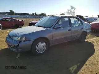 1998 Toyota Corolla VE with VIN 1NXBR18E3WZ129335, listed as a Copart auction lot 80774134 with 182,443 mi miles and Salvage title. Bid and sale history available at DreamBid. Image 1.