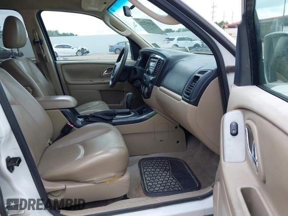 2006 Mazda Tribute i with VIN 4F2YZ02Z56KM31953, listed as a IAAI auction lot 42167223 with 185,169 mi miles and . Bid and sale history available at carsss.com. Image 5.