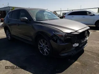 2019 Mazda CX-5 Grand Touring with VIN JM3KFADM6K1641992, listed as a Copart auction lot 57862345 with 37,100 mi miles and Salvage title. Bid and sale history available at DreamBid. Image 14.