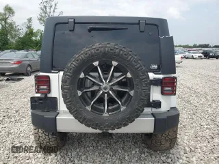 2014 Jeep Wrangler Unlimited Sahara with VIN 1C4BJWEG8EL266340, listed as a Copart auction lot 57809465 with 121,191 mi miles and Salvage title. Bid and sale history available at DreamBid. Image 6.