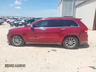 2014 Jeep Grand Cherokee Summit with VIN 1C4RJFJT1EC237358, listed as a IAAI auction lot 42602245 with 106,821 mi miles and . Bid and sale history available at DreamBid. Image 14.