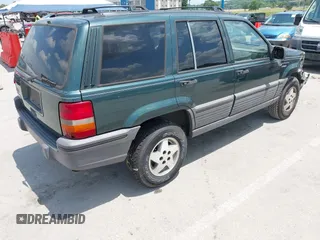 1995 Jeep Grand Cherokee Laredo with VIN 1J4FX58S0SC716398, listed as a IAAI auction lot 42647346 with 58,184 mi miles and . Bid and sale history available at DreamBid. Image 4.