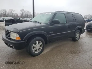 2000 Oldsmobile Bravada z VIN 1GHDT13W5Y2311819, wystawiony jako Copart lot #44839145 z przebiegiem 163 427 mil mil oraz Tytuł czysty. Historia ofert i sprzedaży dostępna na DreamBid. Obrazek 1.