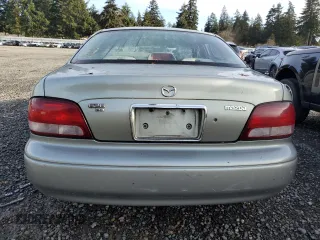 1999 Mazda 626 ES with VIN 1YVGF22C1X5835600, listed as a Copart auction lot 84965004 with 217,352 mi miles and Salvage Title. Bid and sale history available at carsss.com. Image 6.