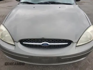 2002 Ford Taurus SE Standard z VIN 1FAFP53U92A246842, wystawiony jako Copart lot #57858765 z przebiegiem 64 545 mil mil oraz Tytuł czysty. Historia ofert i sprzedaży dostępna na DreamBid. Obrazek 11.