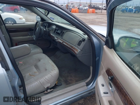 2005 Mercury Grand Marquis LS Premium z VIN 2MEFM75W75X664470, wystawiony jako IAAI lot #41960637 z przebiegiem 191 600 mil mil oraz . Historia ofert i sprzedaży dostępna na DreamBid. Obrazek 5.