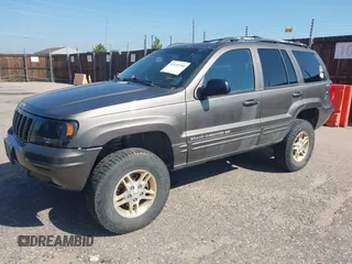 1999 Jeep Grand Cherokee Limited with VIN 1J4GW68N7XC617687, listed as a IAAI auction lot 42433705 with 186,312 mi miles and . Bid and sale history available at DreamBid. Image 2.