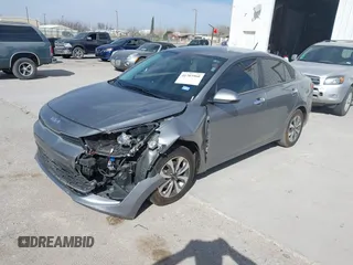 2023 Kia Rio LX with VIN 3KPA24AD3PE592647, listed as a IAAI auction lot 41703960 with 16,480 mi miles. Bid and sale history available at carsss.com. Image 2.