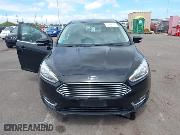 2017 Ford Focus Titanium z VIN 1FADP3N24HL326330, wystawiony jako IAAI lot #42594927 z przebiegiem 54 727 mil mil oraz . Historia ofert i sprzedaży dostępna na DreamBid. Obrazek 6.