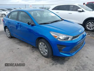 2023 Kia Rio S z VIN 3KPA24AD6PE617766, wystawiony jako IAAI lot #41895375 z przebiegiem 13 147 mil mil oraz . Historia ofert i sprzedaży dostępna na DreamBid. Obrazek 1.