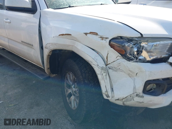 2017 Toyota Tacoma SR5 with VIN 5TFAZ5CN8HX043633, listed as a IAAI auction lot 41520703 with 104,711 mi miles and . Bid and sale history available at DreamBid. Image 6.