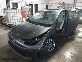 2021 Toyota Prius L Eco with VIN JTDKAMFU9M3132587, listed as a IAAI auction lot 41637275 with 84,203 mi miles. Bid and sale history available at carsss.com. Image 2.