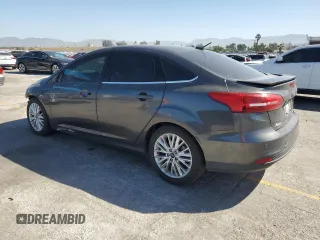 2017 Ford Focus Titanium with VIN 1FADP3J22HL279854, listed as a Copart auction lot 61209135 with 106,323 mi miles and Salvage title. Bid and sale history available at DreamBid. Image 2.