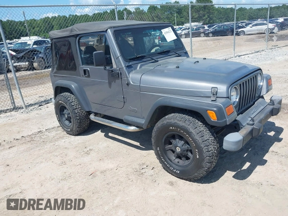 2002 Jeep Wrangler Sport z VIN 1J4FA49S62P731507, wystawiony jako IAAI lot #42584222 z przebiegiem 206 661 mil mil oraz . Historia ofert i sprzedaży dostępna na DreamBid. Obrazek 1.