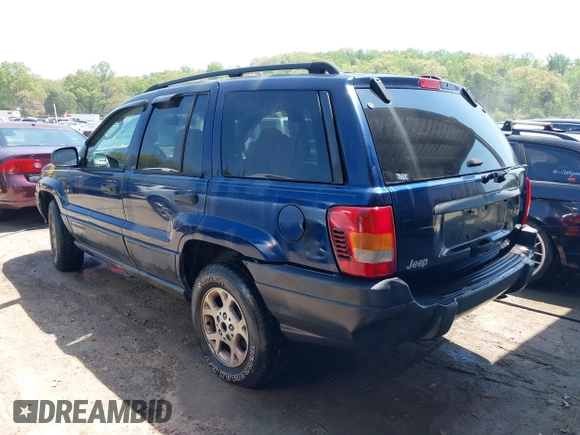 2003 Jeep Grand Cherokee Laredo with VIN 1J4GX48S83C548090, listed as a IAAI auction lot 42039918 with 243,209 mi miles. Bid and sale history available at carsss.com. Image 3.