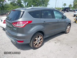 2014 Ford Escape Titanium with VIN 1FMCU0JX9EUE35382, listed as a IAAI auction lot 42085453 with 162,701 mi miles. Bid and sale history available at carsss.com. Image 4.