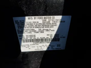 2014 Ford Taurus Limited z VIN 1FAHP2J8XEG170806, wystawiony jako Copart lot #84871394 z przebiegiem 170 124 mil mil oraz Czysty tytuł • Clean title. Historia ofert i sprzedaży dostępna na DreamBid. Obrazek 12.