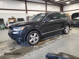 2011 Volkswagen Touareg Exec with VIN WVGFK9BP8BD003948, listed as a Copart auction lot 48285065 with 152,497 mi miles and Salvage Title. Bid and sale history available at DreamBid. Image 1.