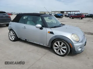 2011 MINI Convertible with VIN WMWZN3C53BTZ89332, listed as a Copart auction lot 45945515 with 25,809 mi miles and Salvage title. Bid and sale history available at DreamBid. Image 4.