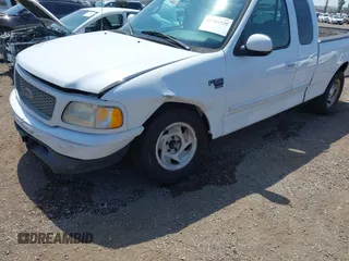 2000 Ford F-150 XL with VIN 1FTRX17L2YNA03263, listed as a IAAI auction lot 42326528 with Not provided miles and . Bid and sale history available at DreamBid. Image 6.
