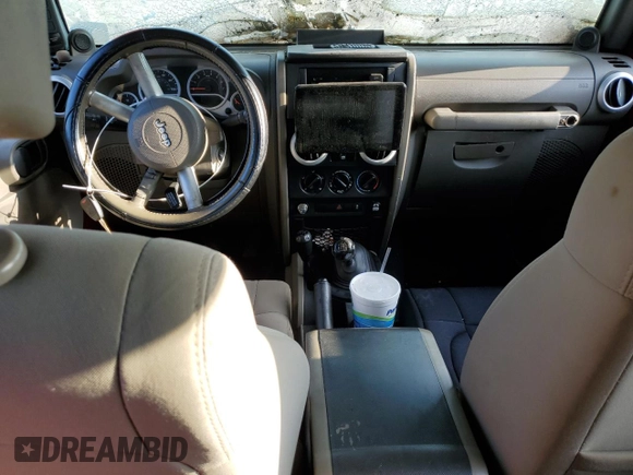 2010 Jeep Wrangler Unlimited Sahara with VIN 1J4BA5H13AL141851, listed as a Copart auction lot 63486504 with 0 mi miles and Salvage Title. Bid and sale history available at carsss.com. Image 8.