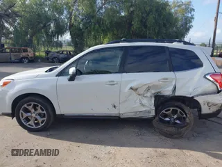 2016 Subaru Forester Touring with VIN JF2SJAXC7GH565287, listed as a IAAI auction lot 41947083 with 126,563 mi miles and . Bid and sale history available at DreamBid. Image 14.