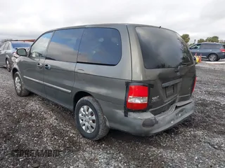 2004 Kia Sedona LX with VIN KNDUP131346533373, listed as a IAAI auction lot 41632342 with 76,545 mi miles. Bid and sale history available at carsss.com. Image 3.