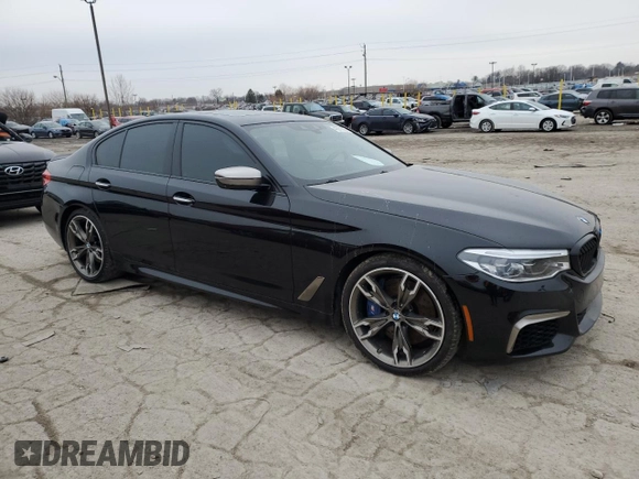 2018 BMW 5 Series M550i xDrive with VIN WBAJB9C56JB049524, listed as a Copart auction lot 43511805 with 55,759 mi miles and Salvage title. Bid and sale history available at DreamBid. Image 4.