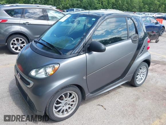 2013 Smart fortwo Pure with VIN WMEEJ3BA9DK585327, listed as a IAAI auction lot 42343616 with 101,194 mi miles and . Bid and sale history available at DreamBid. Image 2.