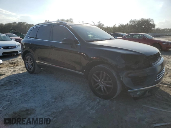 2016 Volkswagen Touareg Sport with VIN WVGEF9BP7GD010767, listed as a Copart auction lot 44782585 with 125,970 mi miles and Salvage Title. Bid and sale history available at DreamBid. Image 4.