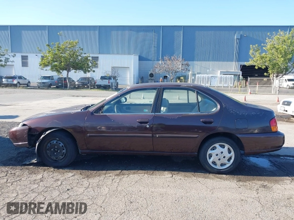 1999 Nissan Altima XE with VIN 1N4DL01D3XC209869, listed as a IAAI auction lot 41414580 with 175,076 mi miles. Bid and sale history available at carsss.com. Image 14.