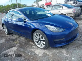 2020 Tesla Model 3 Standard Range Plus z VIN 5YJ3E1EA4LF661395, wystawiony jako IAAI lot #41999610 z przebiegiem 112 200 mil mil oraz . Historia ofert i sprzedaży dostępna na DreamBid. Obrazek 1.