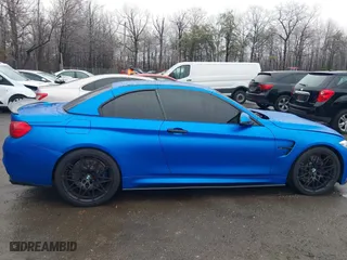 2015 BMW M4 with VIN WBS3U9C5XFJ968082, listed as a IAAI auction lot 41513593 with 57,715 mi miles. Bid and sale history available at carsss.com. Image 13.